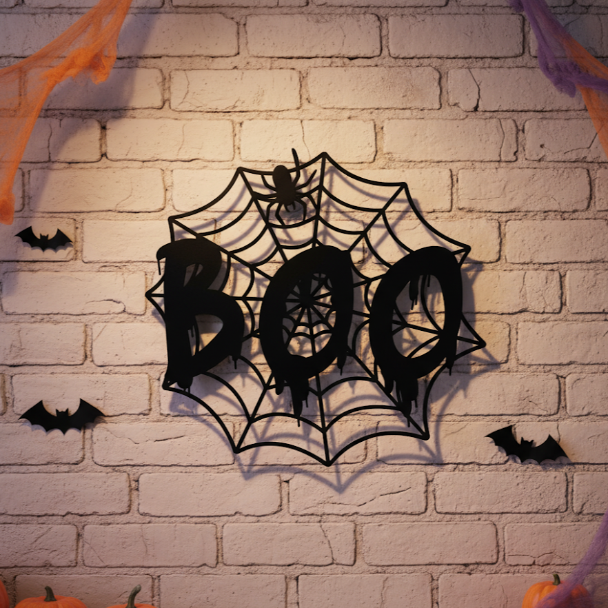 Halloween-themed wall decoration with 'BOO' and spider web design on a brick wall.